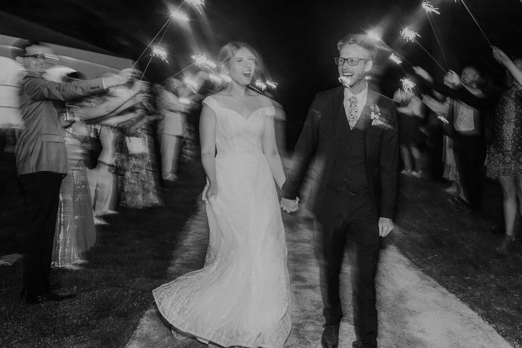 Bride and Groom During a Sparkler Exit